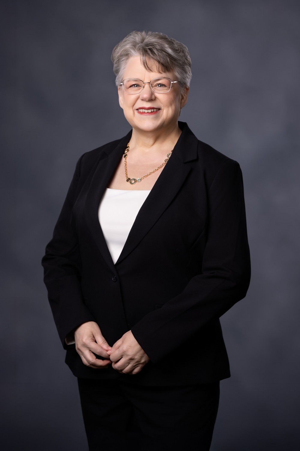 Wendy Cary - 202502 - 2x3 2 Wendy Cary wearing a black blazer and off-white shirt
